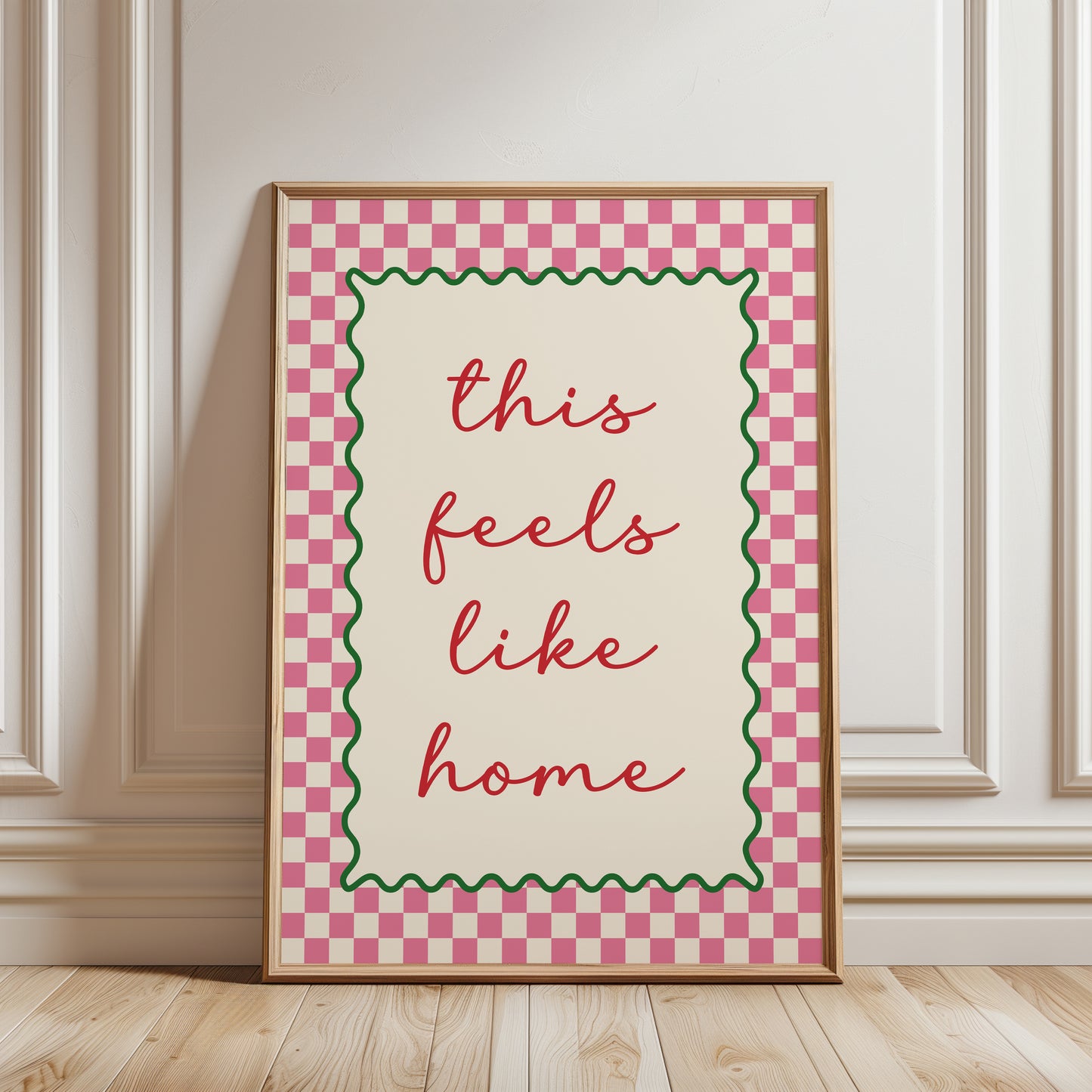 Modern hallway gallery wall art print with quote "this feels like home" in pink with a chequered border