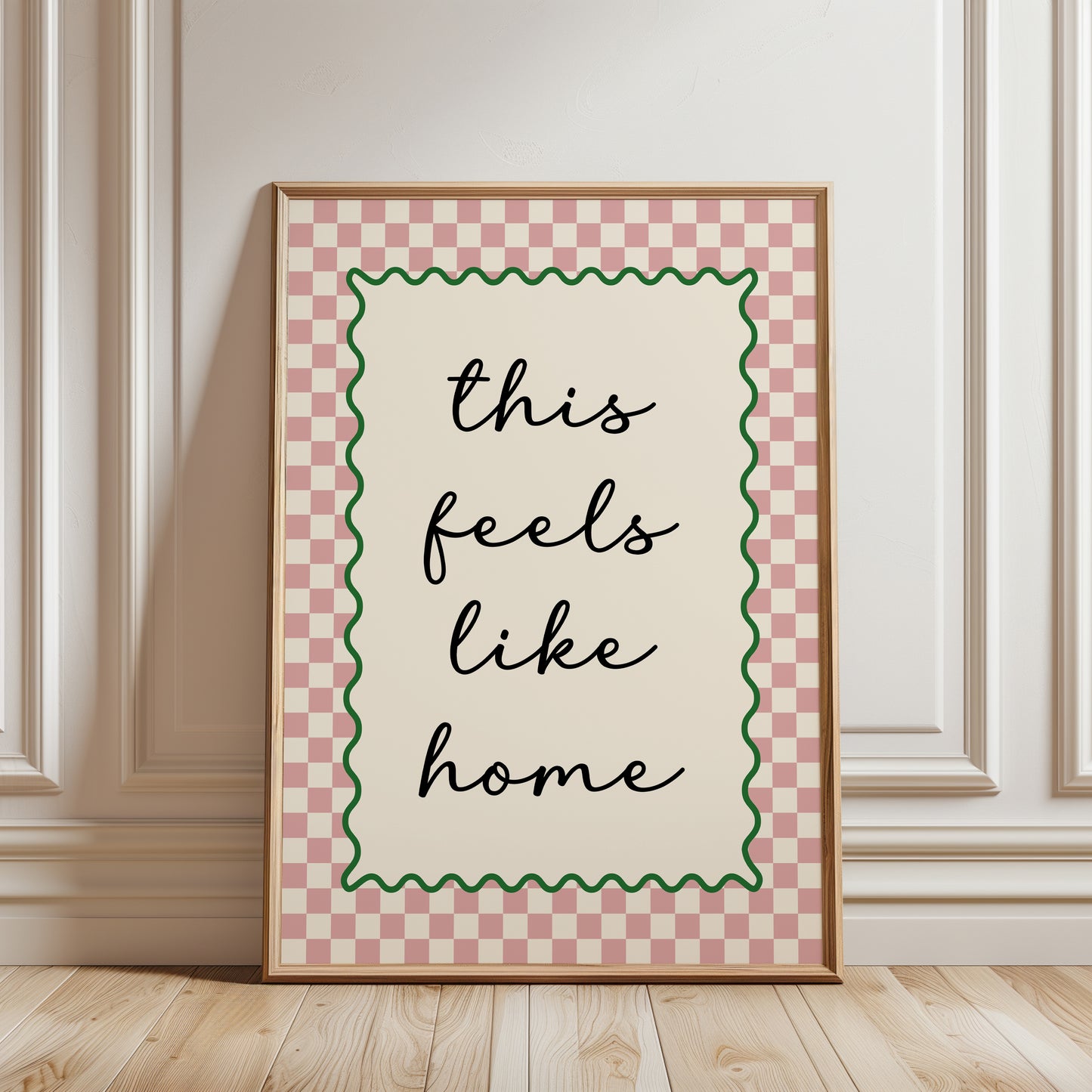 Modern hallway gallery wall art print with quote "this feels like home" in pink with a chequered border