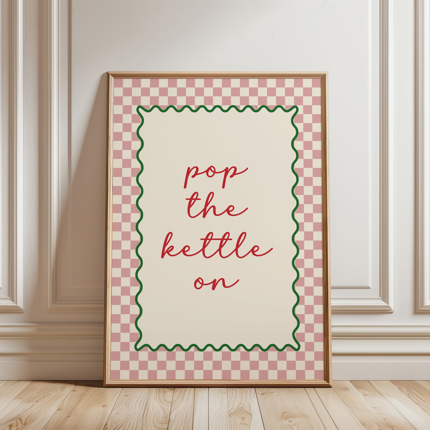 Pink kitchen print with quote "POP THE KETTLE ON" with a funky chequered border