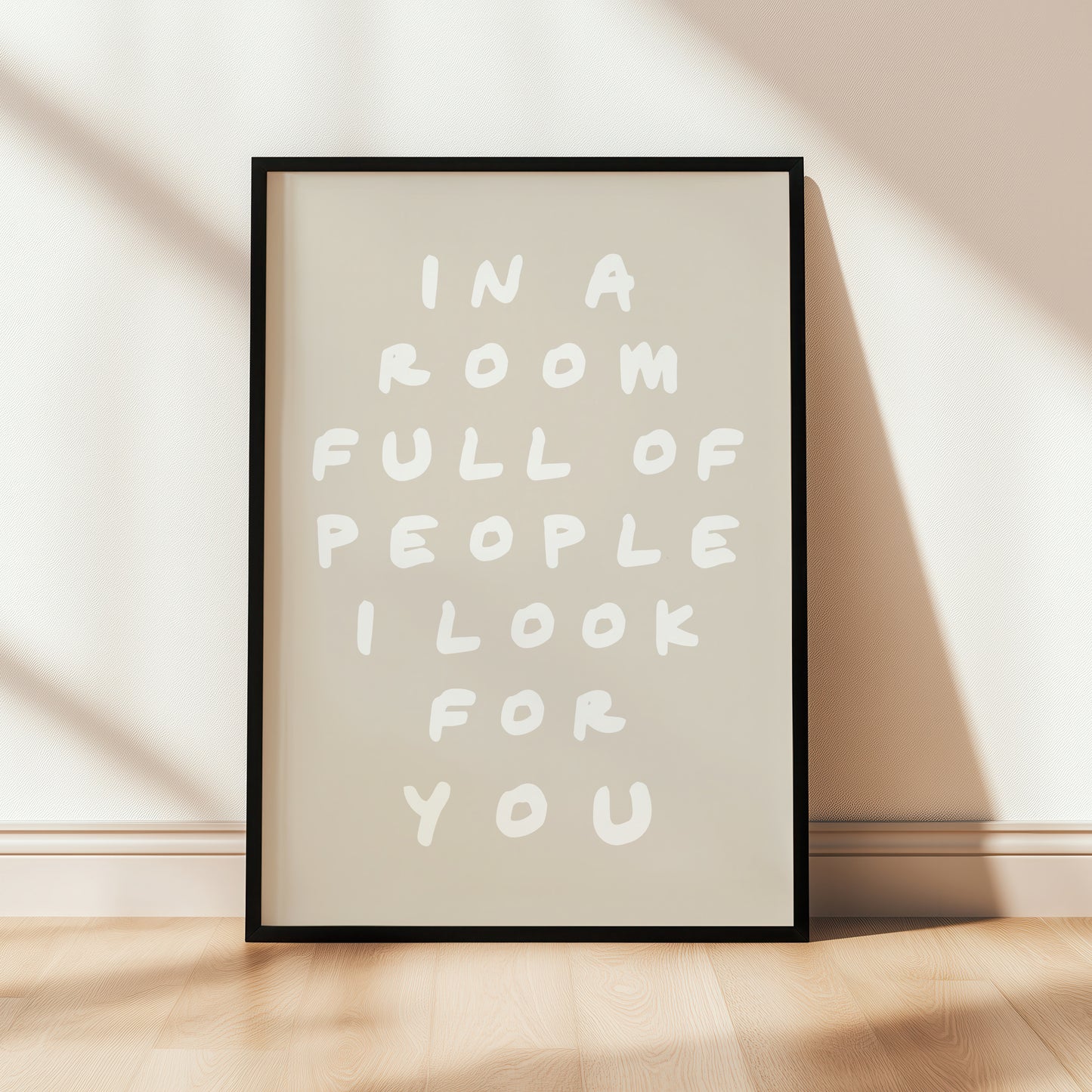 Beige typography hallway print with quote; "in a room full of people i look for you"