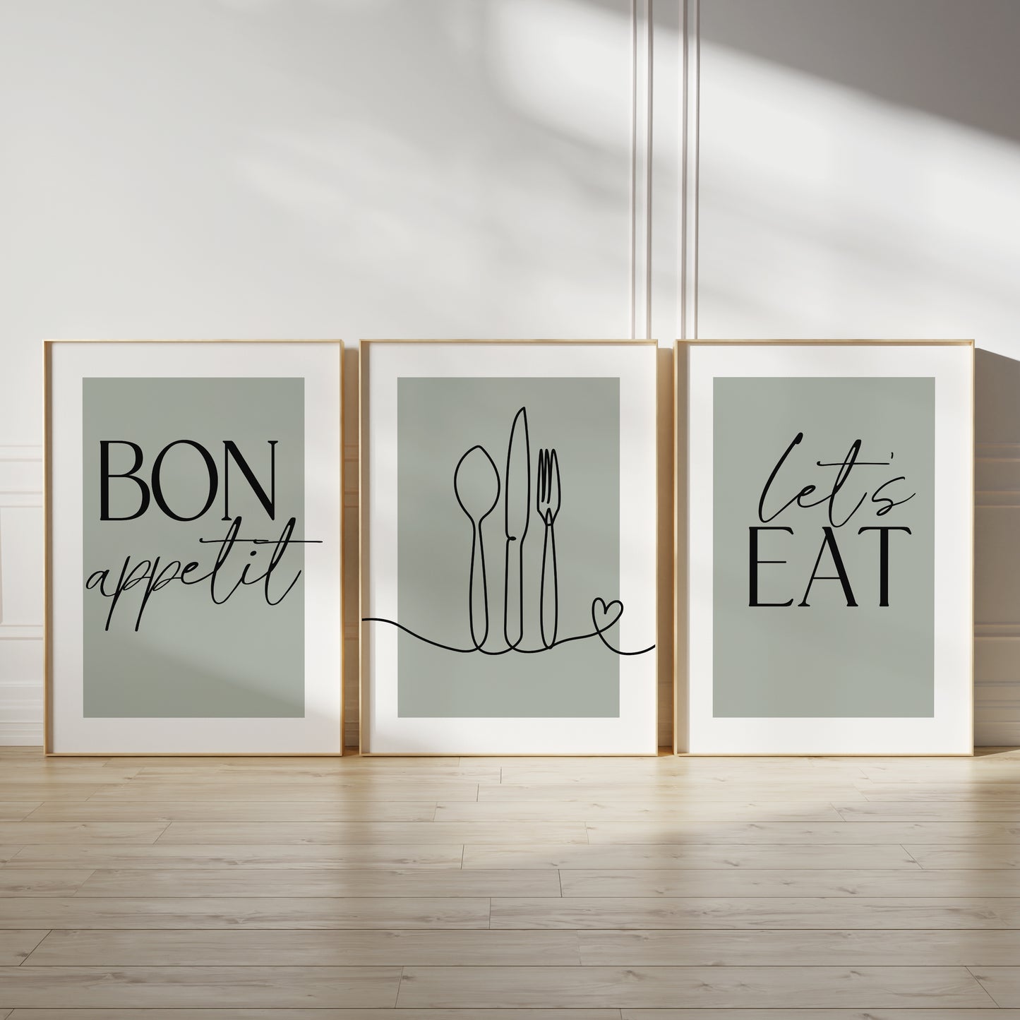 Sage green kitchen wall art set, set of three prints with quote BON APPETIT, LETS EAT and line drawn cutlery with love heart on the middle print