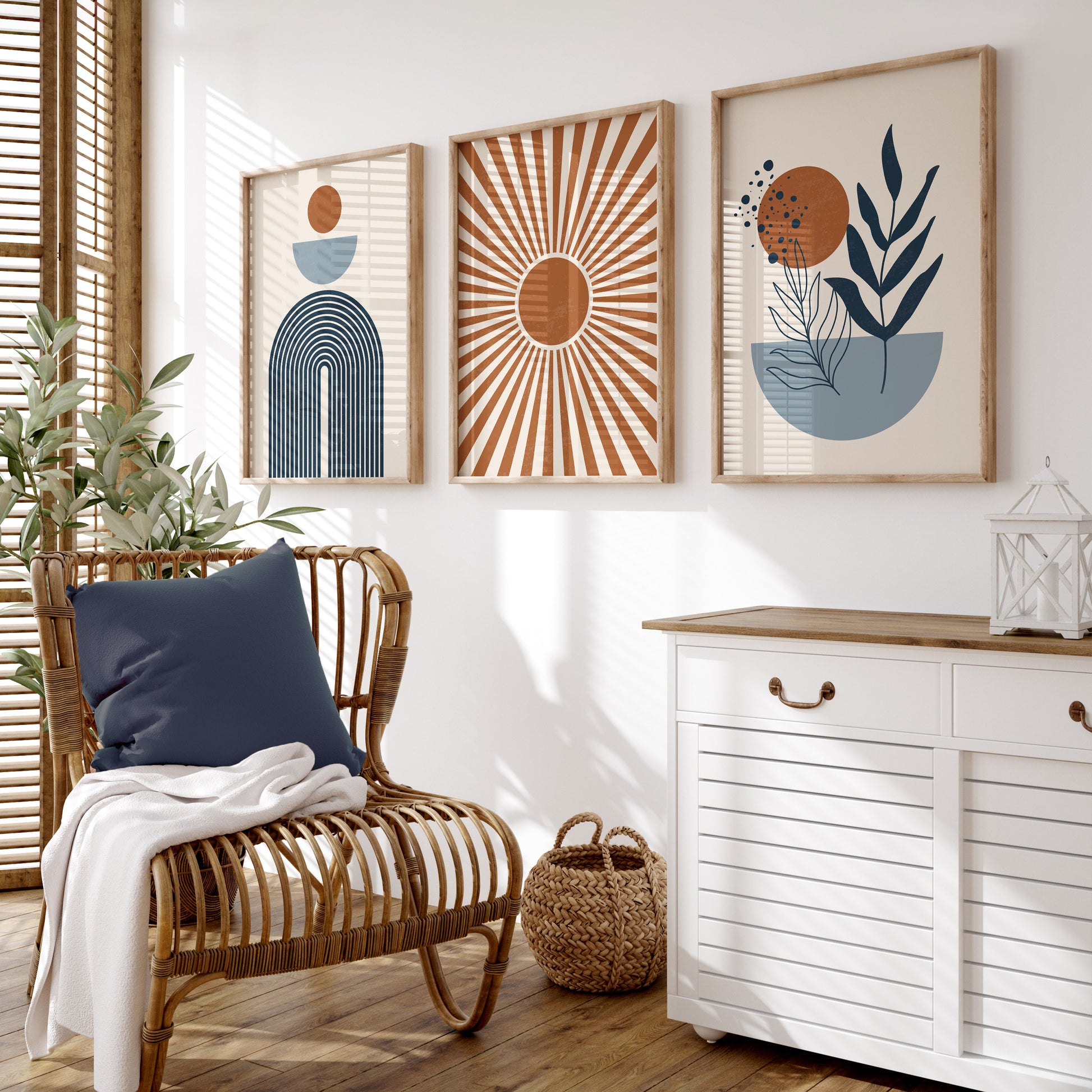 Three unframed abstract boho-style wall art prints. The prints feature neutral tones, blue, orange, and beige geometric and botanical motifs.
