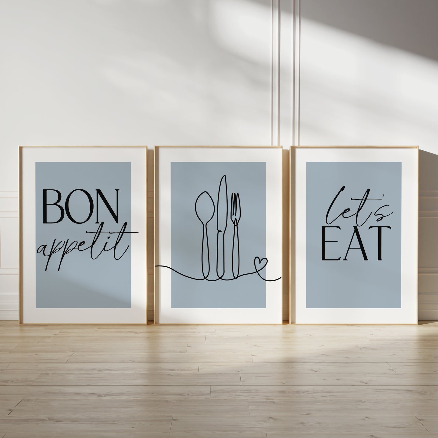 Blue kitchen wall art set, set of three prints with quote BON APPETIT, LETS EAT and line drawn cutlery with love heart on the middle print