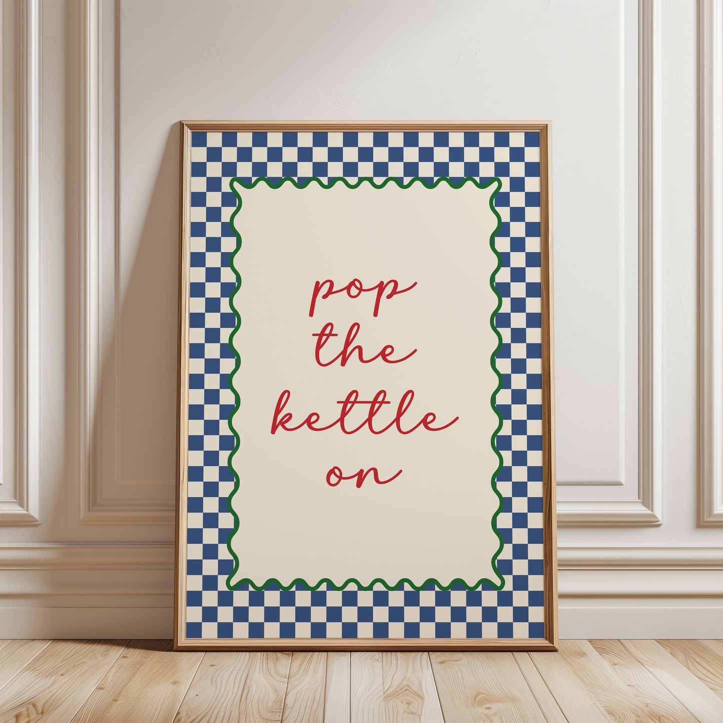 Blue kitchen print with quote "POP THE KETTLE ON" with a funky chequered border