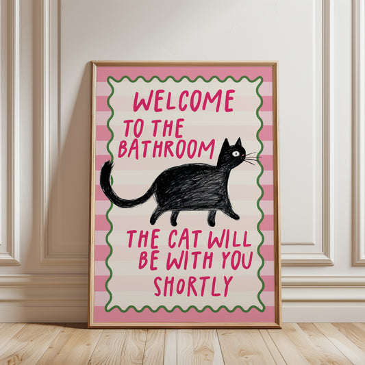 Pink funny bathroom cat wall art print featuring a black cat and the quote "Welcome to the Bathroom, the Cat Will Be With You Shortly".