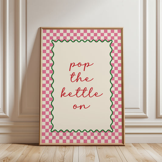 Pink home decor, wall art print with quote "POP THE KETTLE ON" with a funky chequered border for kitchen wall or dining room wall