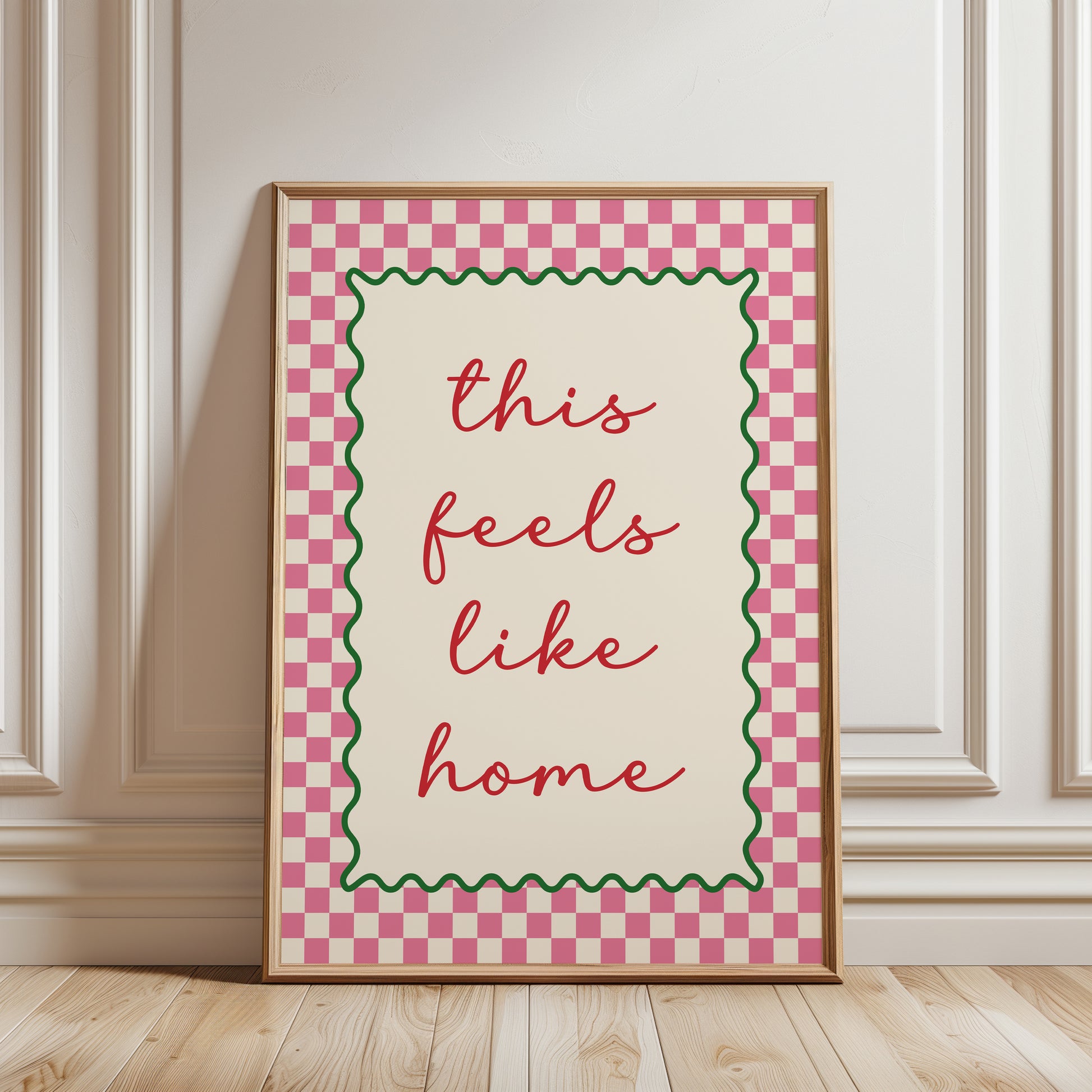 Modern hallway gallery wall art print with quote "this feels like home" in pink with a chequered border