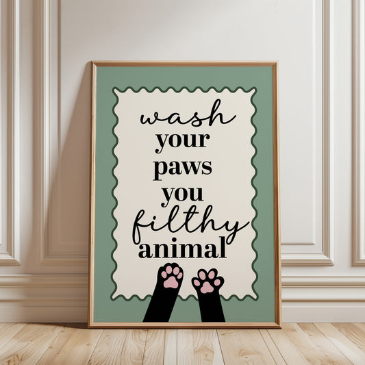 Sage green bathroom wall art print with funny quote "WASH YOUR PAWS YOU FILTHY ANIMAL" and illustrated cat paws 
