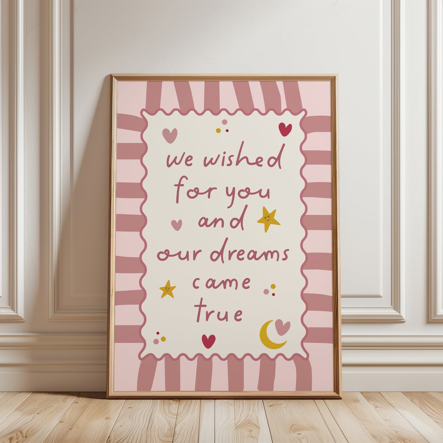 Pink nursery print for girls room with love heart, stars and moon illustrations and quote reading "we wished for you and our dreams came true"