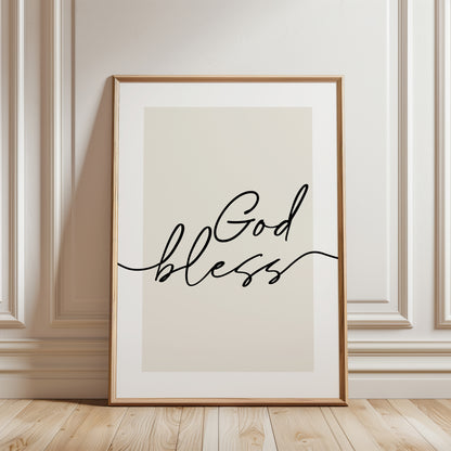typographic wall art print. The print features the words 'God bless' in black cursive script over a warm beige background with white border