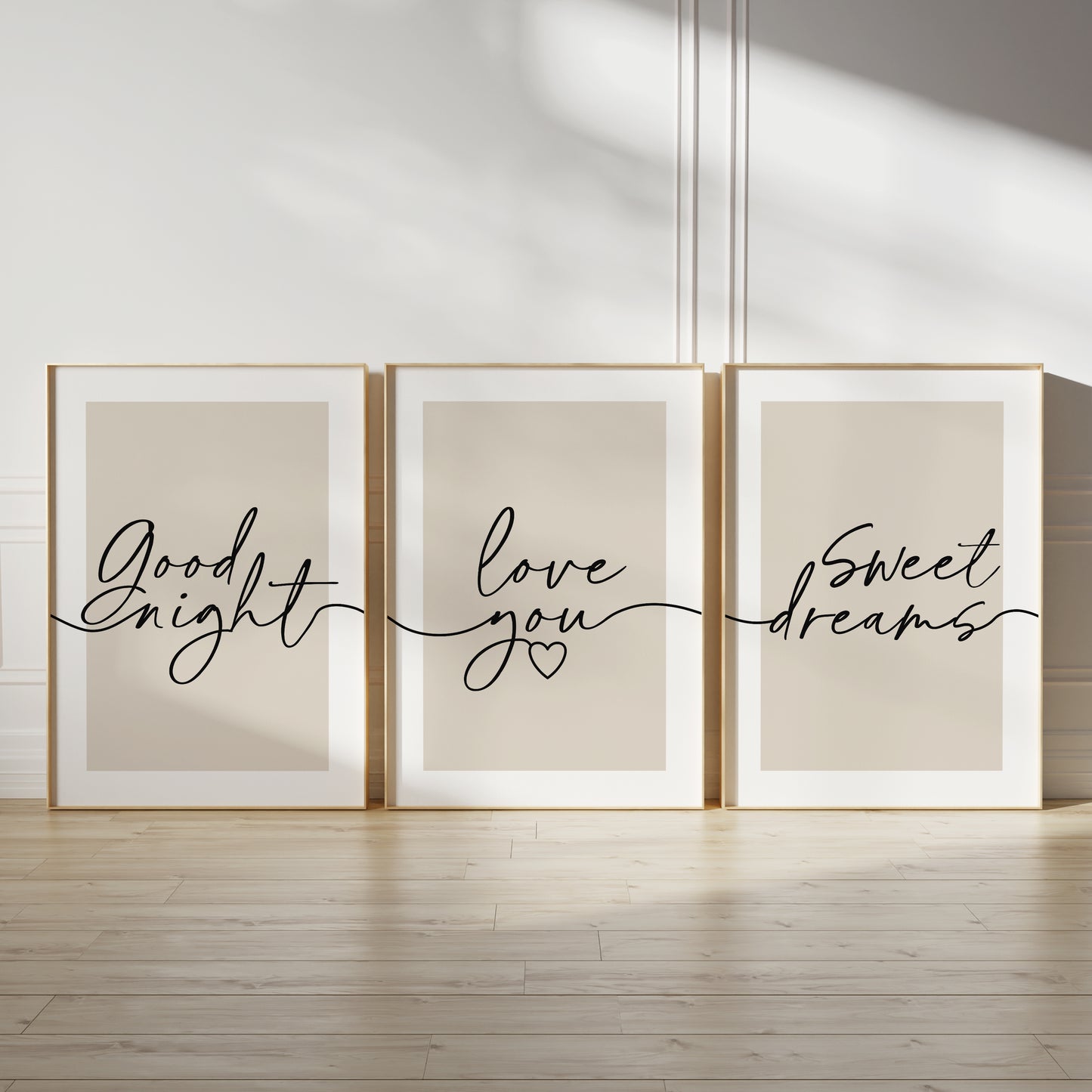 Three unframed wall art prints  The prints have beige backgrounds with black script text reading 'Good night,' 'love you,' and 'Sweet dreams,' each ona beige background with white border