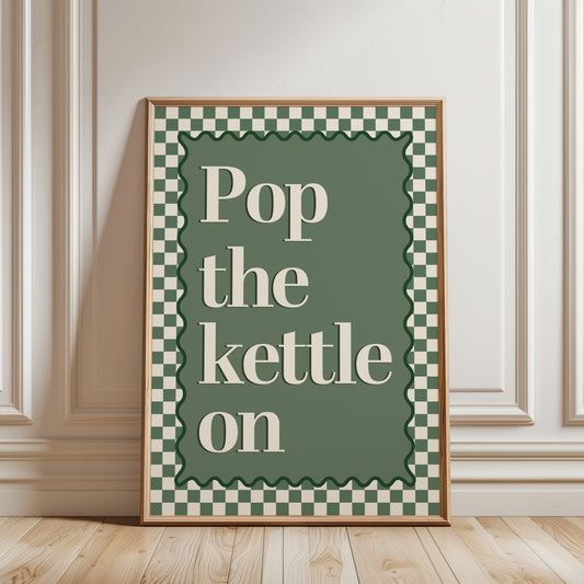 Green chequered kitchen print with quote "POP THE KETTLE ON"