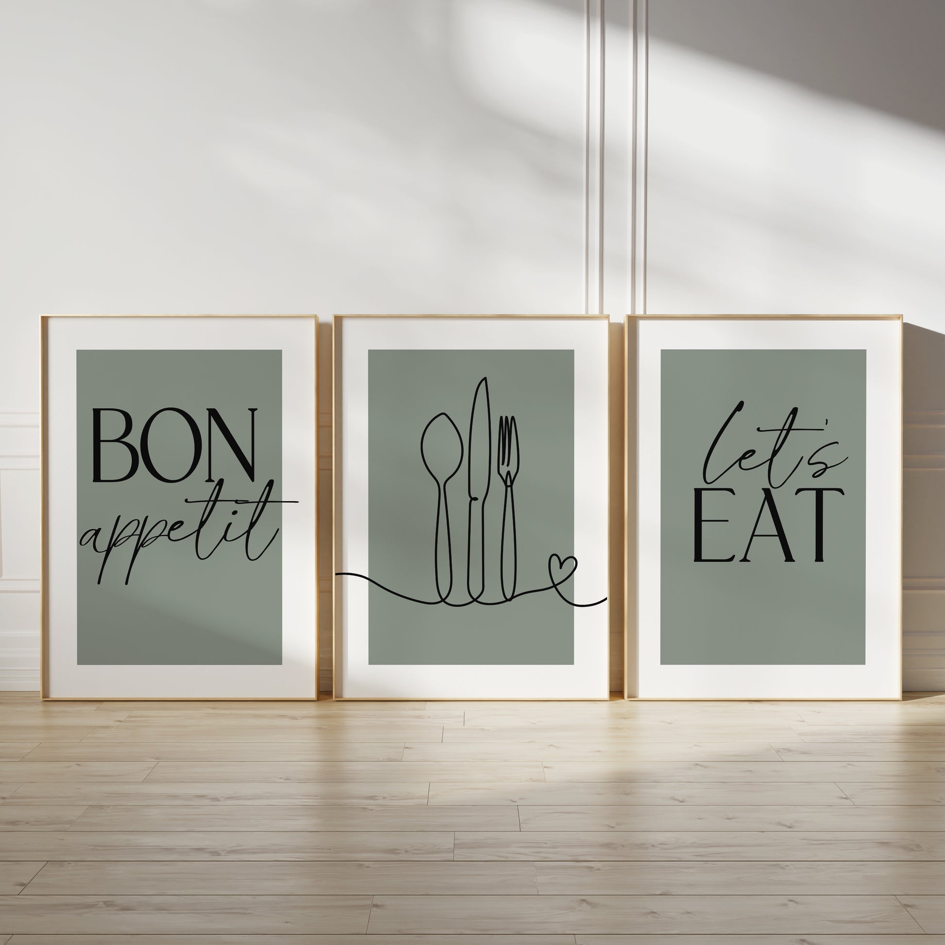 Green kitchen wall art set, set of three prints with quote BON APPETIT, LETS EAT and line drawn cutlery with love heart on the middle print