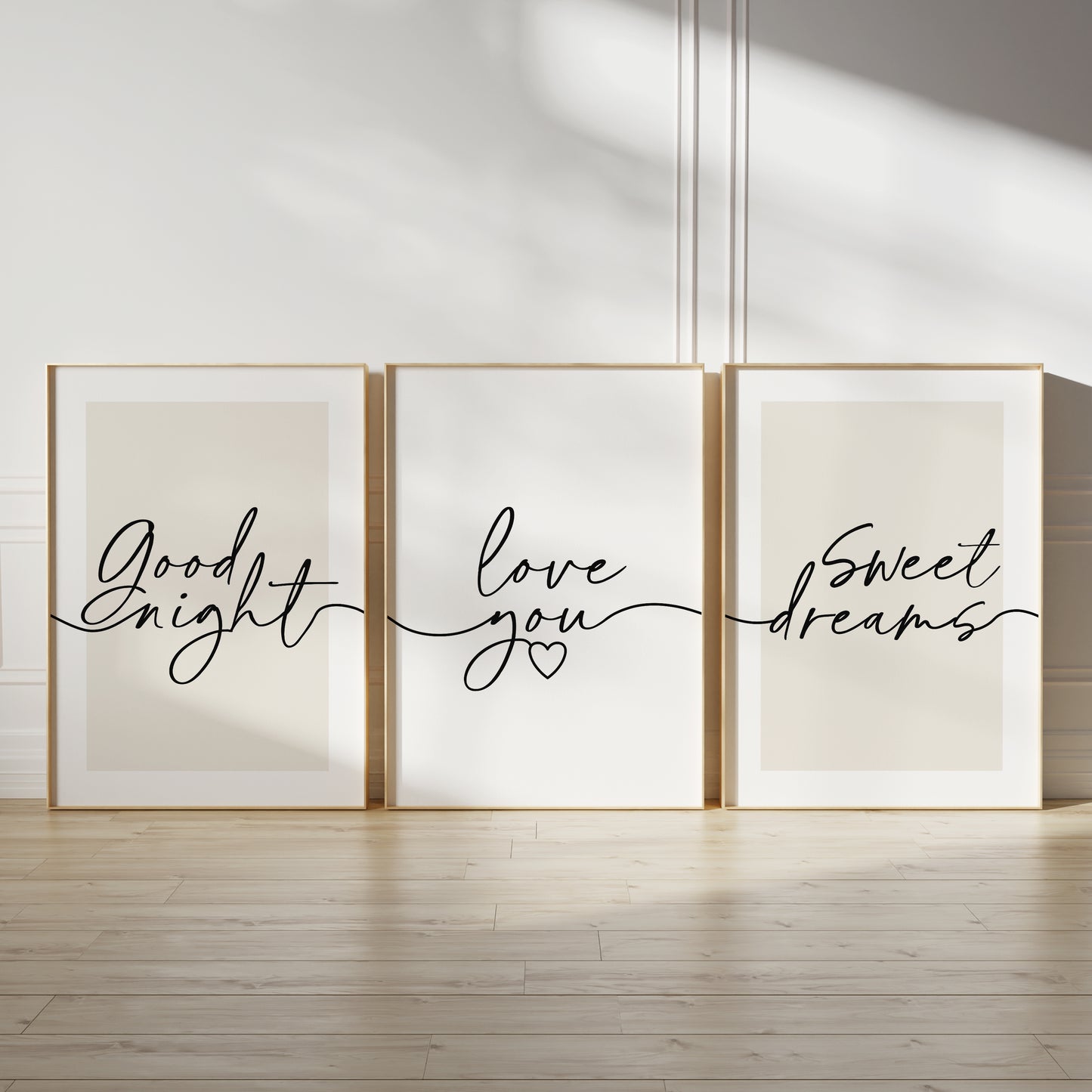 couples bedroom wall art, trio of prints with cursive typography reading: GOOD NIGHT, LOVE YOU and SWEET DREAMS, on light beige backgrounds