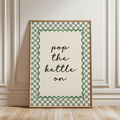 Modern kitchen print in sage green and beige, funny quote "pop the kettle on" in black text with a sage green chequered border