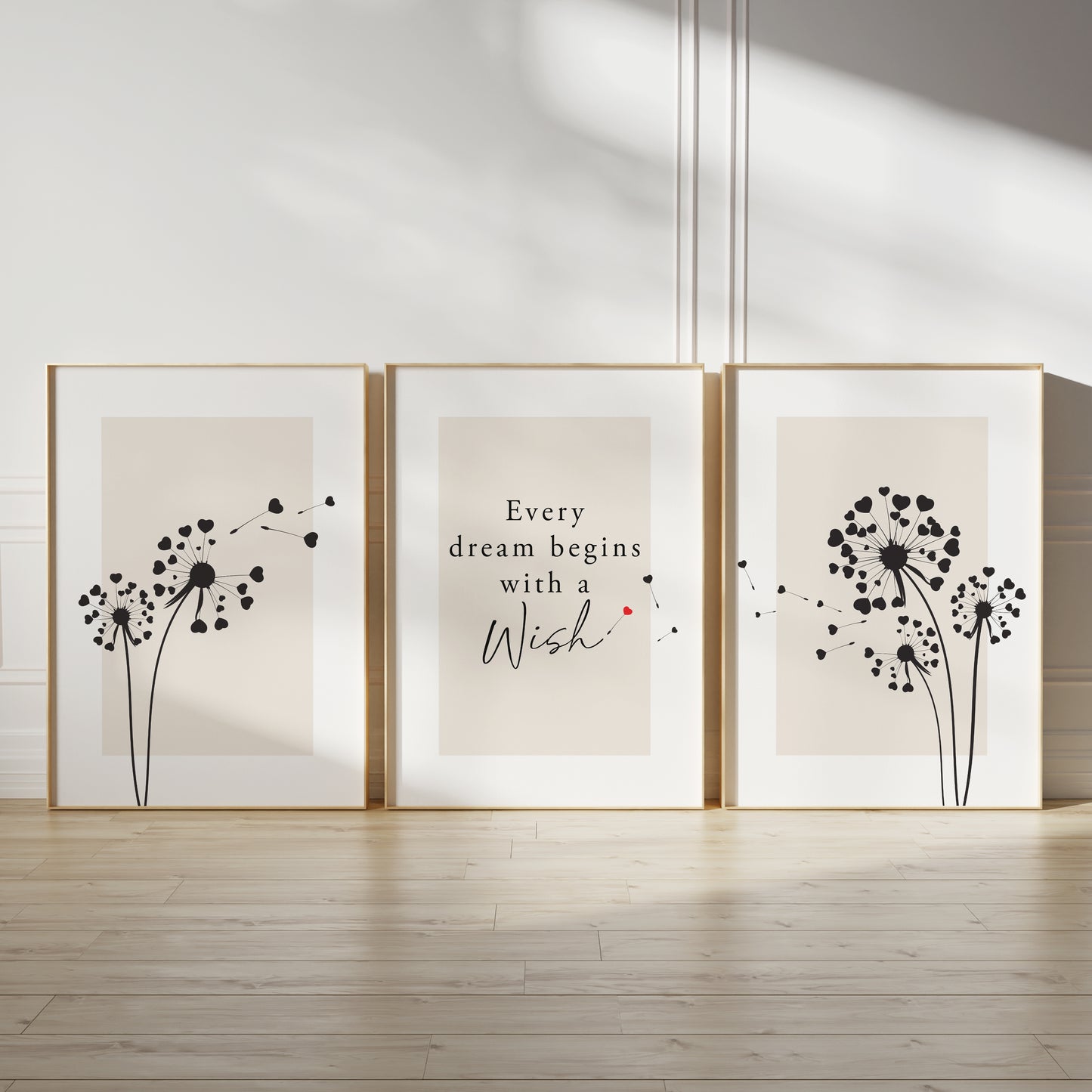 Motivational wall print set, with quote EVERY DREAM BEGINS WITH A WISH, featuring dandelions in black and red on beige backgrounds with white borders, set of three unframed posters