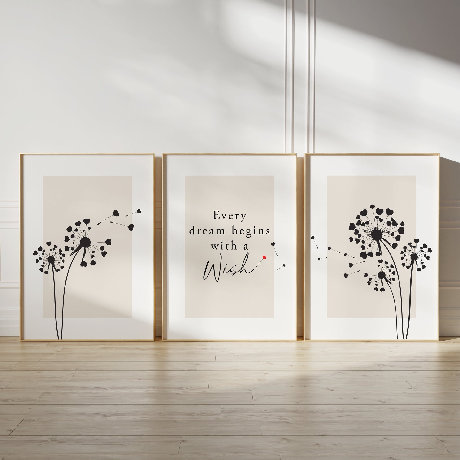 Motivational wall print set, with quote EVERY DREAM BEGINS WITH A WISH, featuring dandelions in black and red on beige backgrounds with white borders, set of three unframed posters