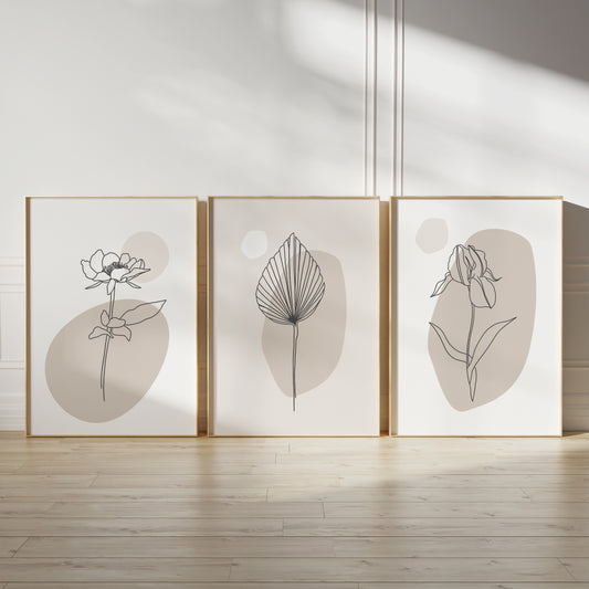 Neutral wall art trio featuring plant line art and abstract shapes