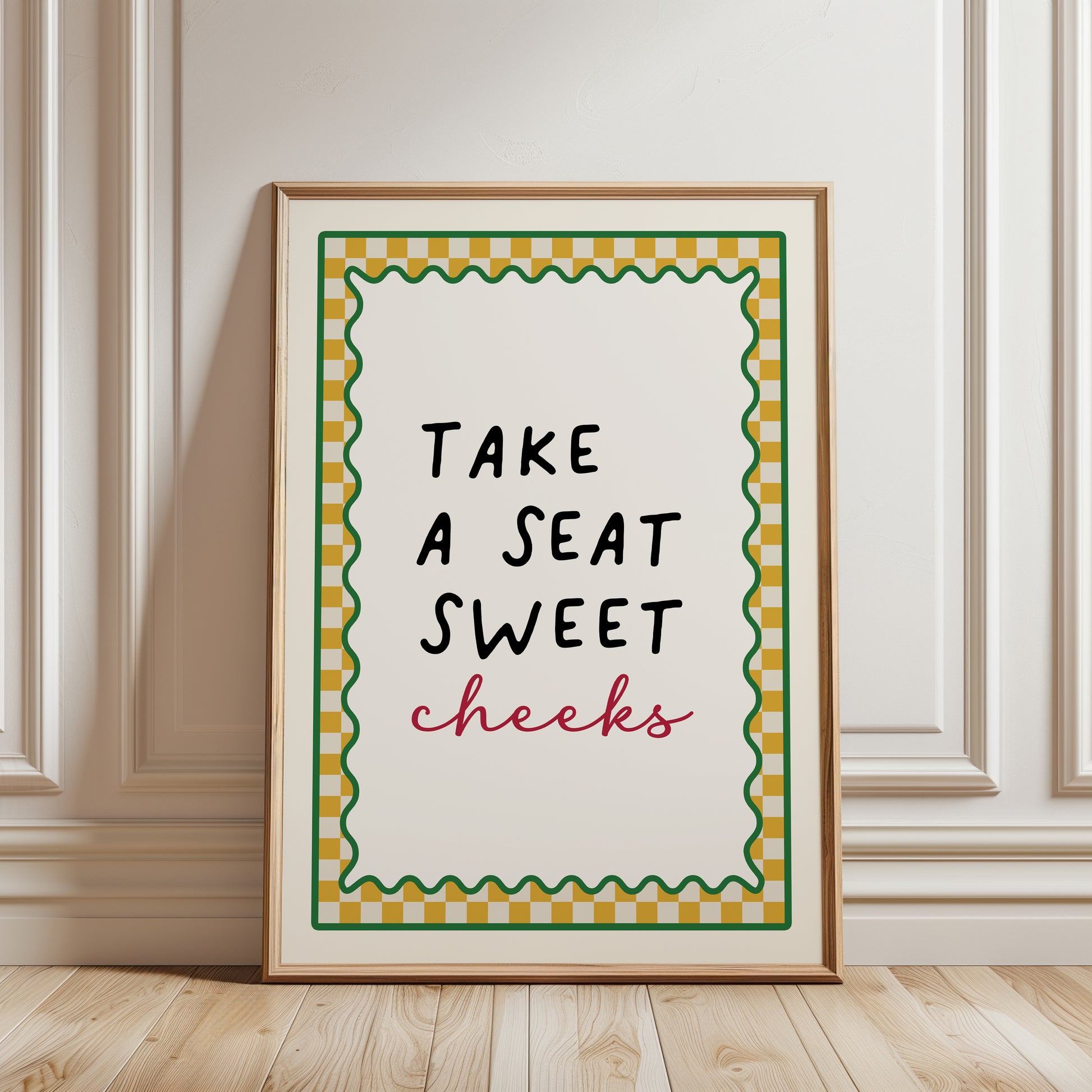 Ochre yellow bathroom print with funny quote, take a seat sweet cheeks and a chequered border. Funky wall art
