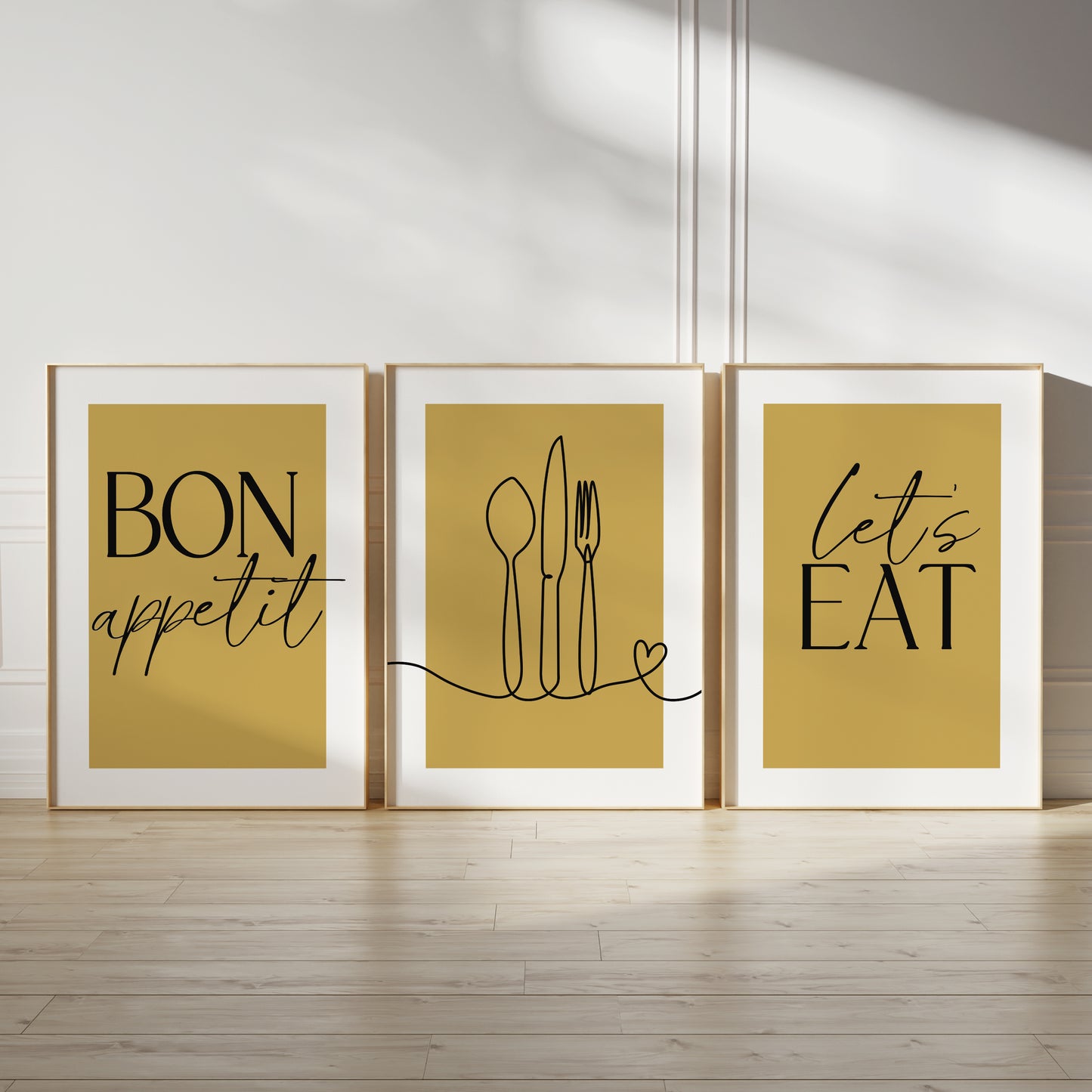 Ochre kitchen wall art set, set of three prints with quote BON APPETIT, LETS EAT and line drawn cutlery with love heart on the middle print