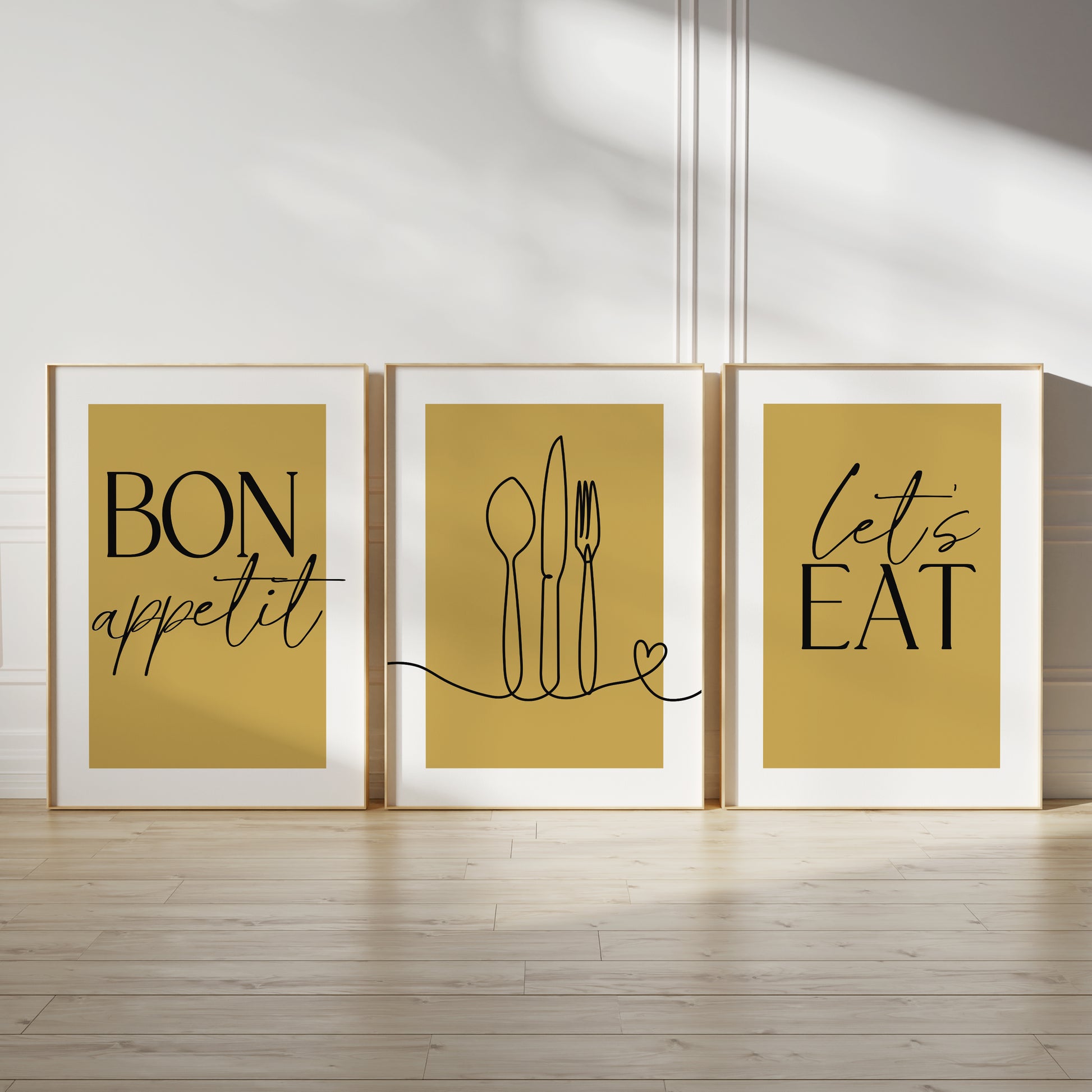 Ochre kitchen wall art set, set of three prints with quote BON APPETIT, LETS EAT and line drawn cutlery with love heart on the middle print
