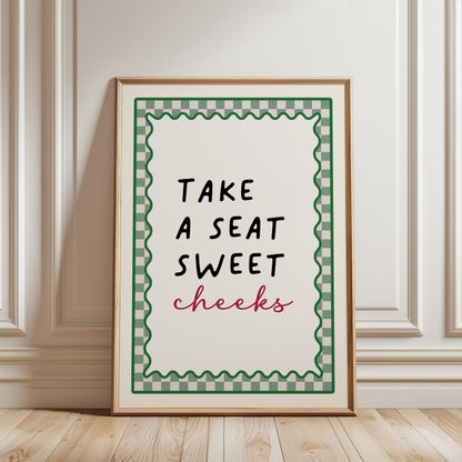 Sage Green bathroom print with funny quote, take a seat sweet cheeks and a chequered border. Funky wall art