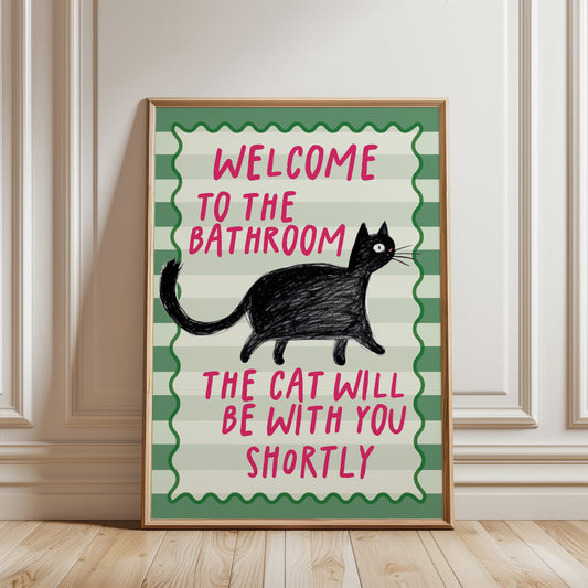 Sage green funny bathroom cat wall art print featuring a black cat and the quote "Welcome to the Bathroom, the Cat Will Be With You Shortly".