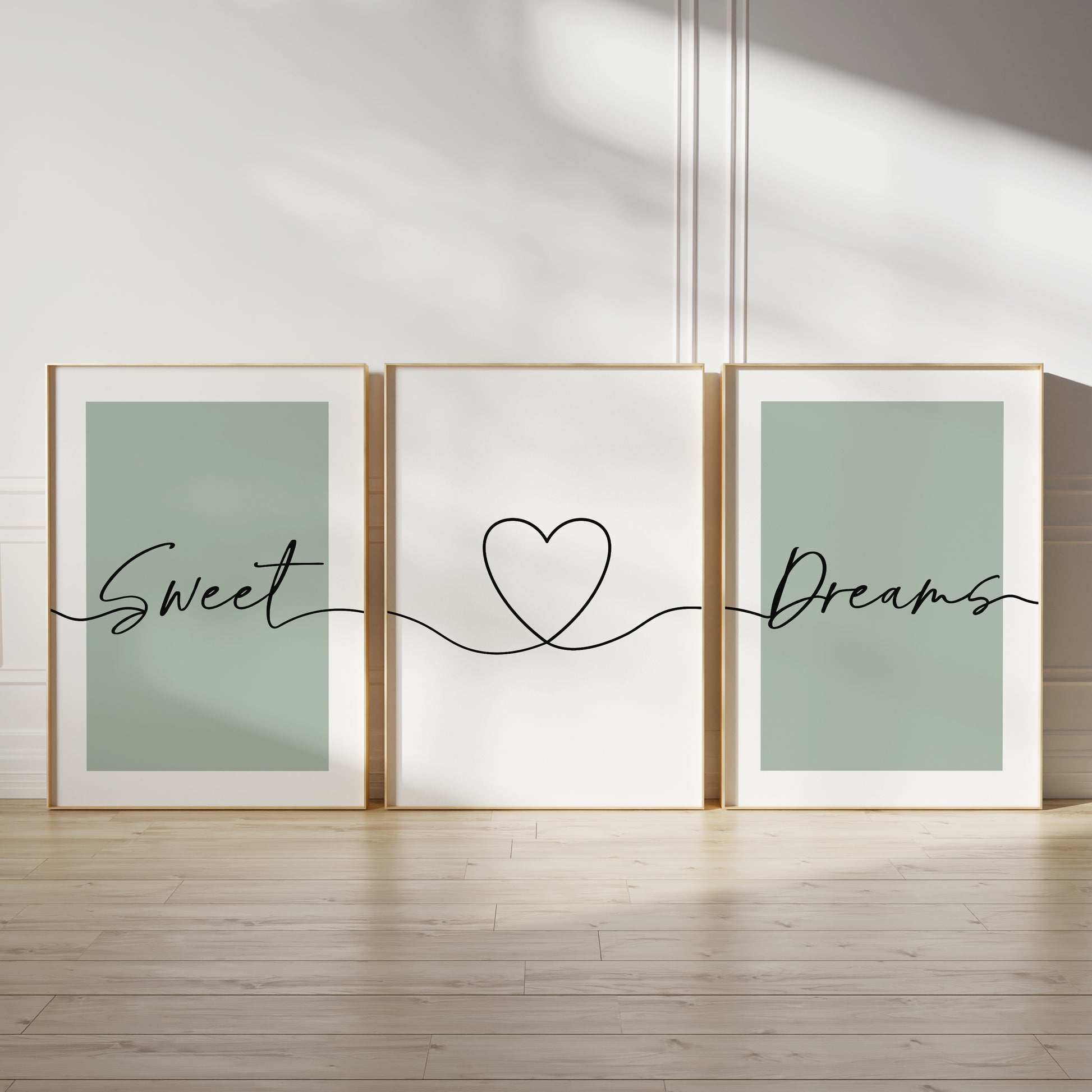 sage green bedroom wall art prints in a three set, with quote SWEET DREAMS and line art love heart