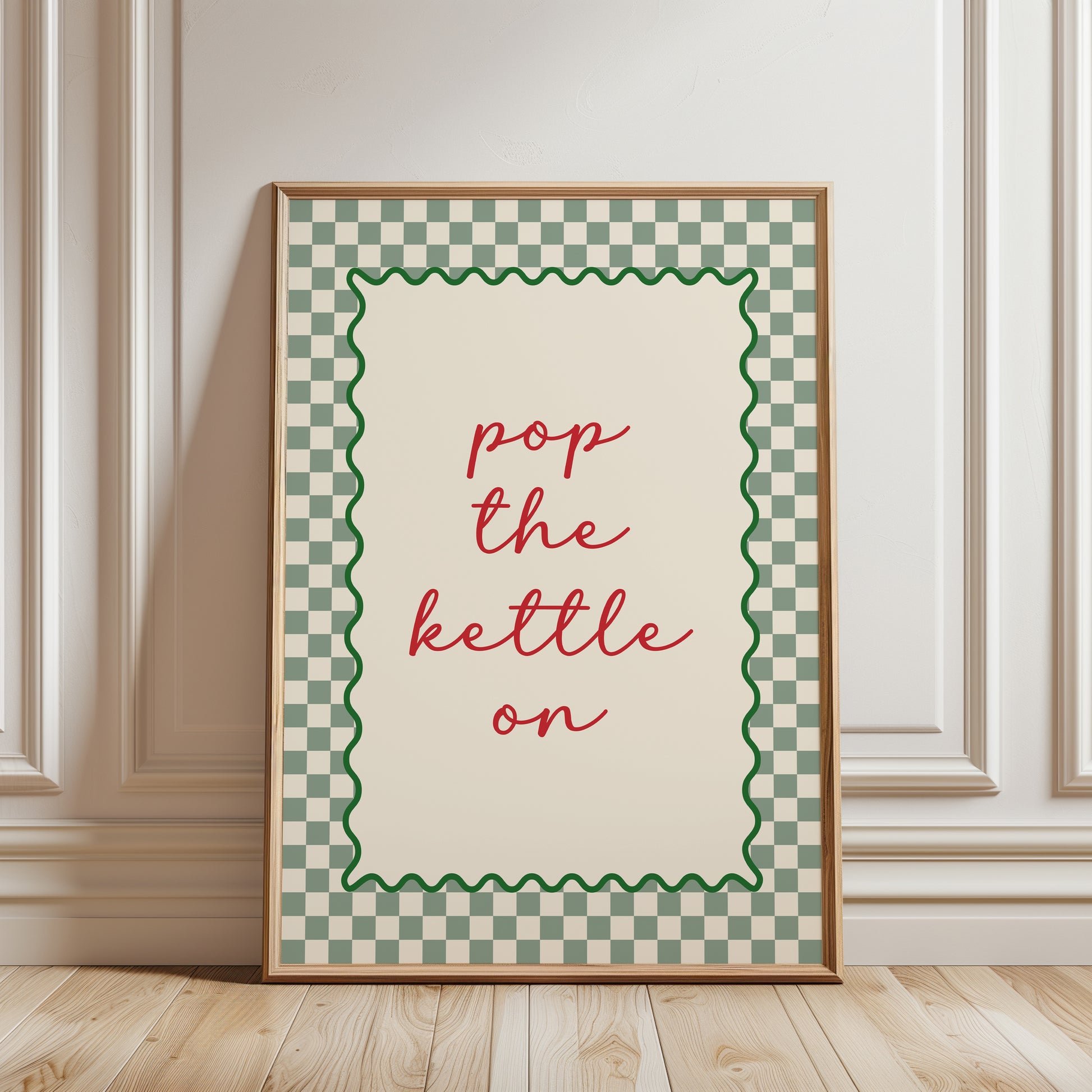 Sage green kitchen print with quote "POP THE KETTLE ON" with a funky chequered border