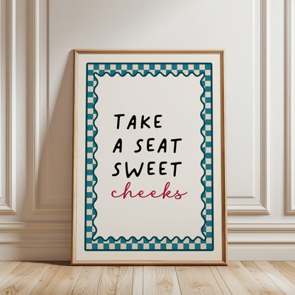 Teal bathroom print with funny quote, take a seat sweet cheeks and a chequered border. Funky wall art