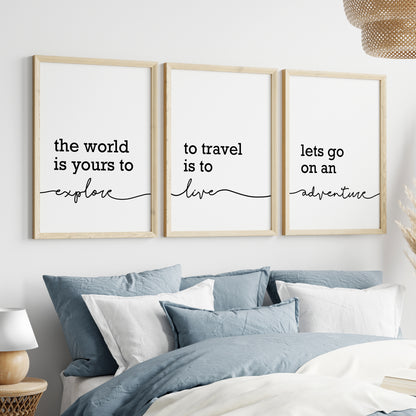 Three unframed wall art prints with black script text on a white background. The prints read: 'the world is yours to explore', 'to travel is to live', and 'lets go on an adventure'.