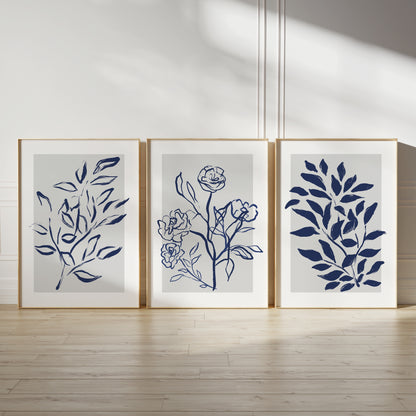Blue home wall art prints, ink drawn plants in blue on grey watercolour backgrounds with white borders, living room decor