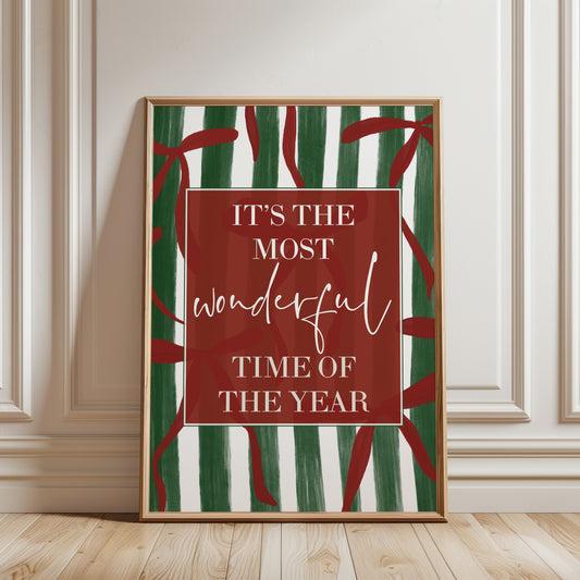 Modern Christmas home decor, wall art print with festive quote "it's te most wonderful time of the year" on a green stripe background with red bows