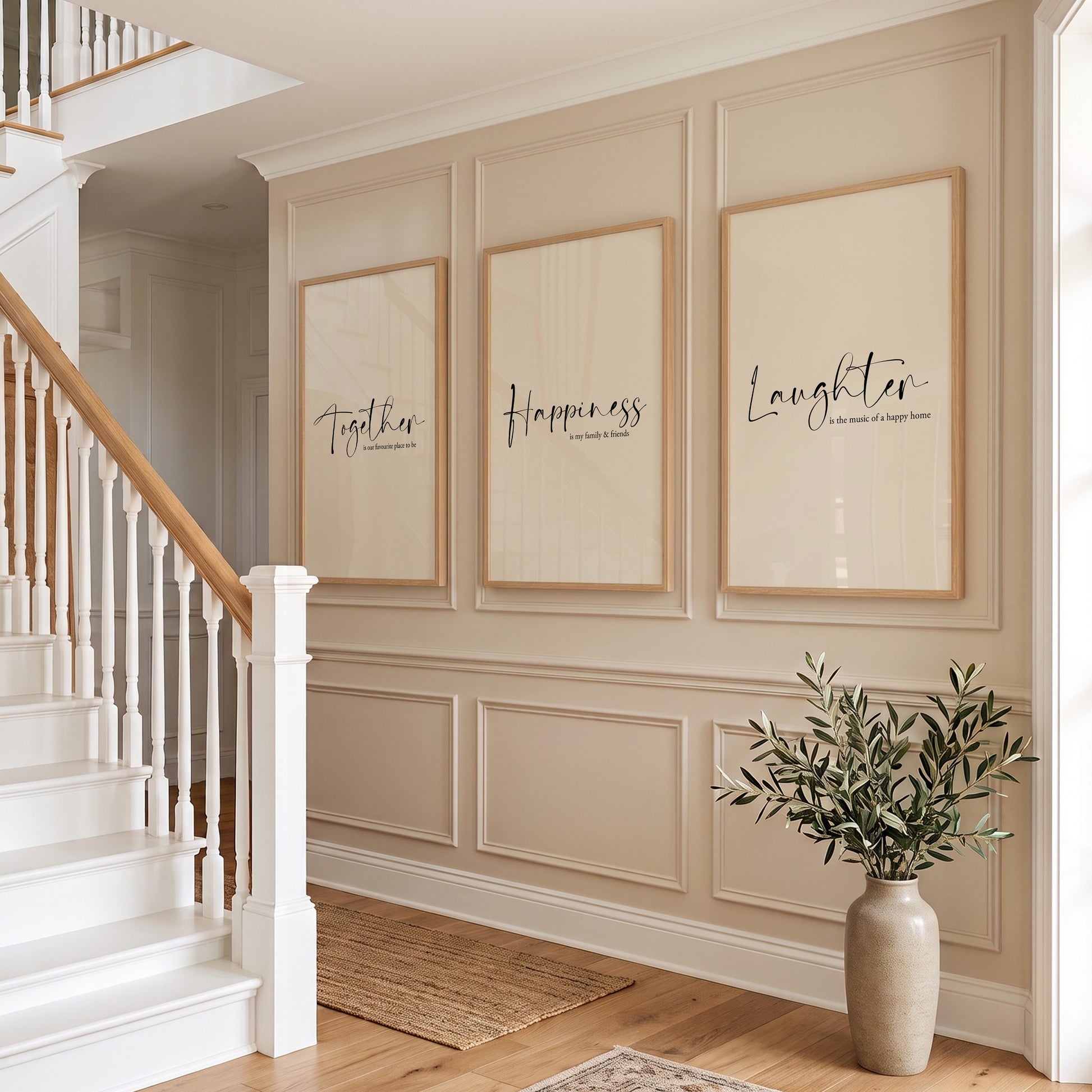 Hallway wall art with family quotes; "Together is our favourite place to be", "Happiness is my family &amp; friends" and "Laughter is the music of a happy home", black text on beige backgrounds.