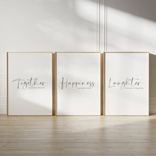 Hallway wall art with family quotes; "Together is our favourite place to be", "Happiness is my family &amp; friends" and "Laughter is the music of a happy home", sage green text on white backgrounds.
